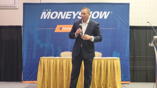 Jeff Barnes speaking on stage at The MoneyShow